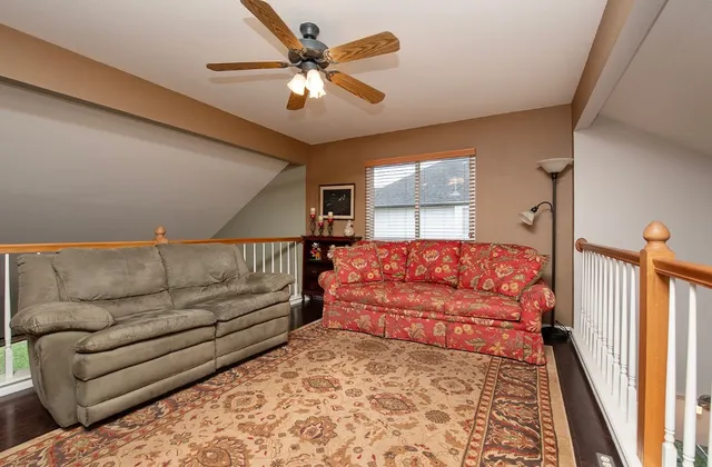 a living room with furniture and a rug