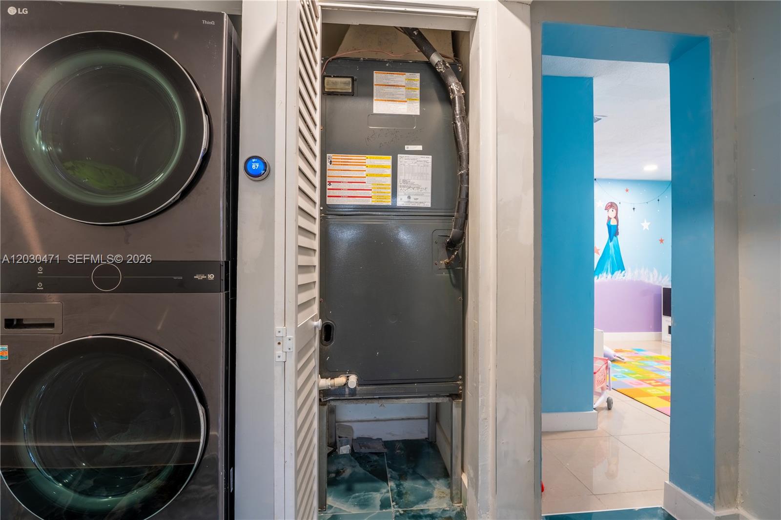 11851 Southwest 181st Street Miami, FL 33177 - Photo 6 of 25 a view of a bedroom with washer and dryer