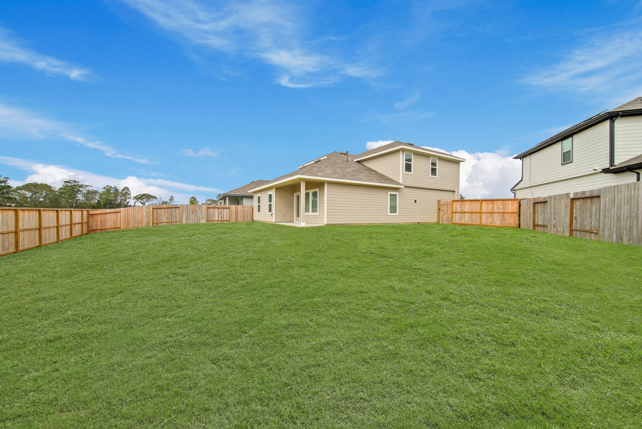 23812 Patchouli Terrace Drive Splendora, TX 77372 - Photo 20 of 27 a view of a house with a big yard