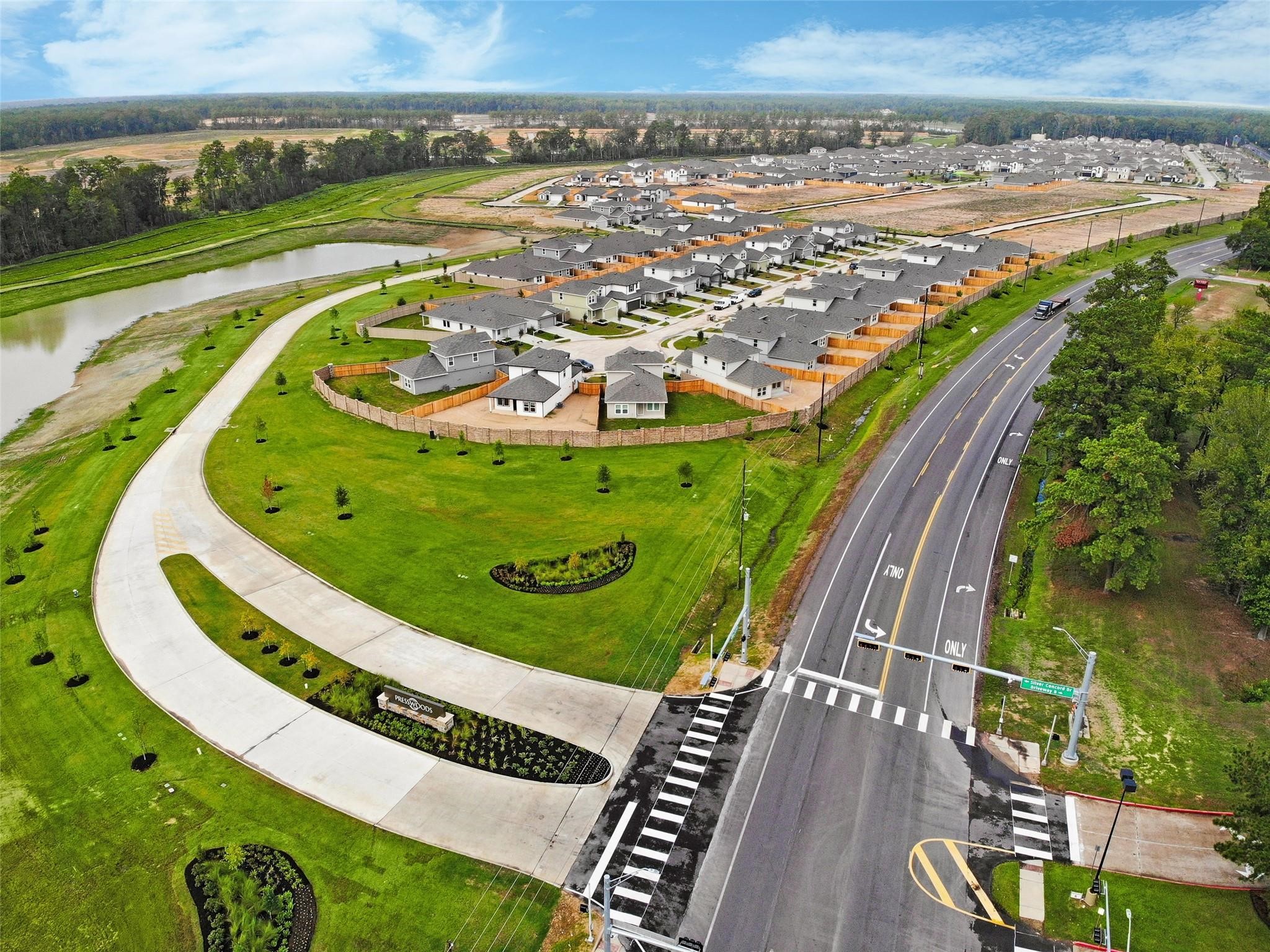 23812 Patchouli Terrace Drive Splendora, TX 77372 - Photo 24 of 27 a view of a swimming pool with a garden