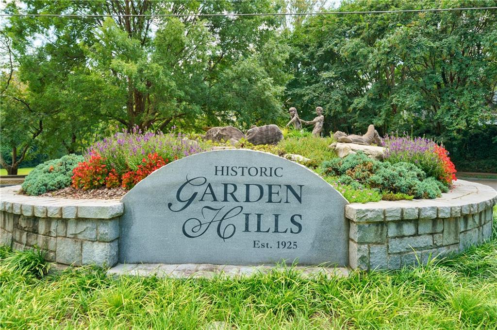 91 Rumson Road Northeast, Unit C34 Atlanta, GA 30305 - Photo 1 of 1 a view of sign board with flower plants
