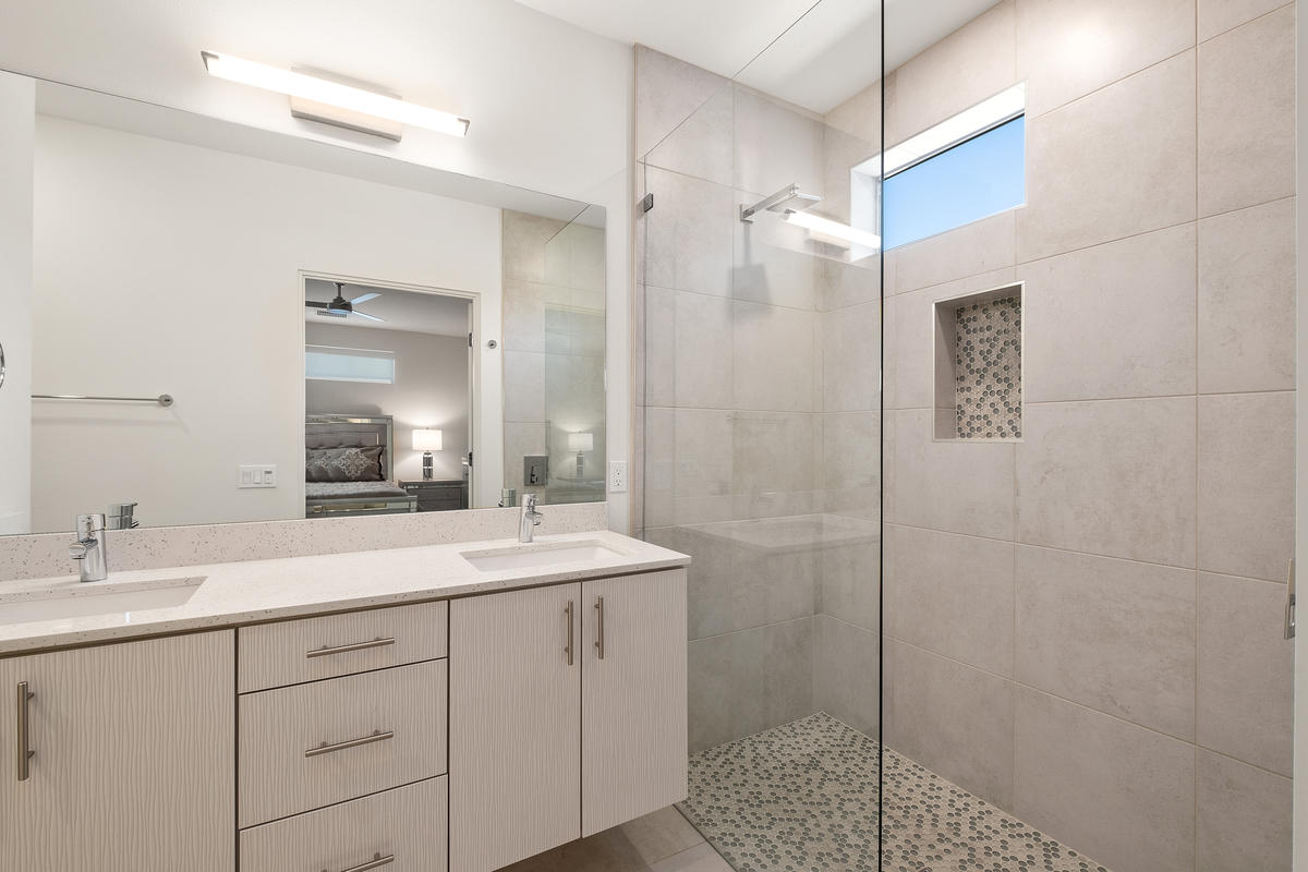 211 The River Palm Springs, CA 92262 - Photo 12 of 21 a bathroom with a shower sink and mirror