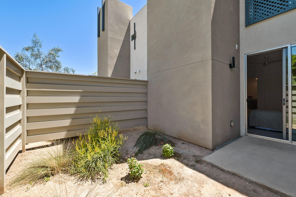 211 The River Palm Springs, CA 92262 - Photo 13 of 21 a view of potted plant in front of a door