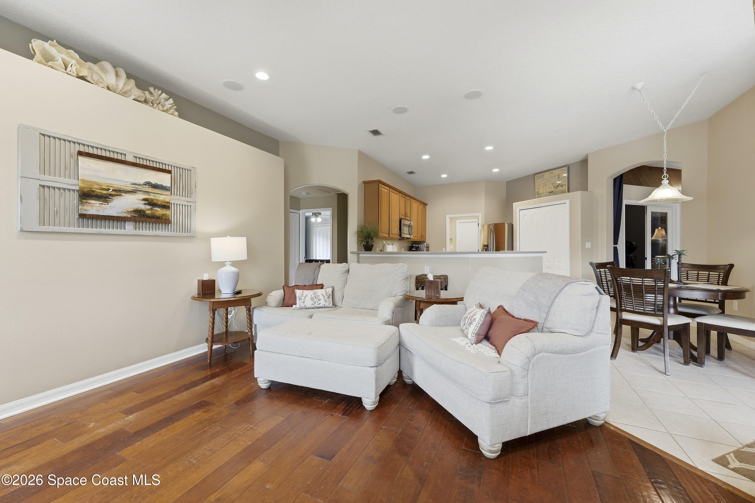 1643 Long Pine Road Melbourne, FL 32940 - Photo 16 of 63 a living room with furniture and a wooden floor