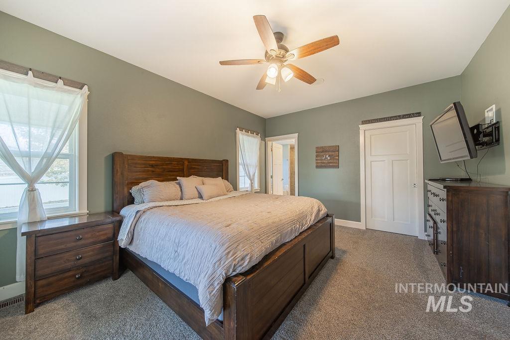 19809 Tammany Creek Road Lewiston, ID 83501 - Photo 16 of 50 Bedroom featuring light carpet and ceiling fan