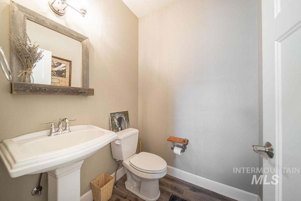 19809 Tammany Creek Road Lewiston, ID 83501 - Photo 21 of 50 Half bath with baseboards and wood finished floors