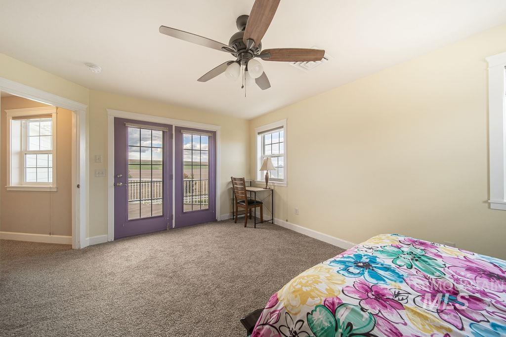 19809 Tammany Creek Road Lewiston, ID 83501 - Photo 30 of 50 Carpeted bedroom with access to exterior and a ceiling fan