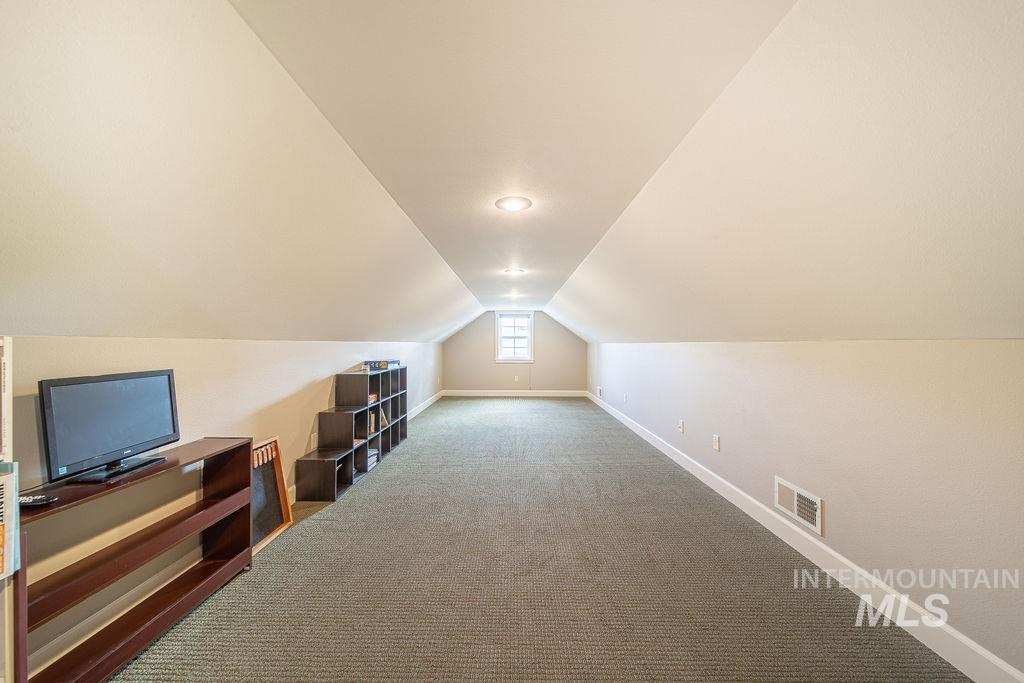19809 Tammany Creek Road Lewiston, ID 83501 - Photo 37 of 50 Bonus room with lofted ceiling and carpet