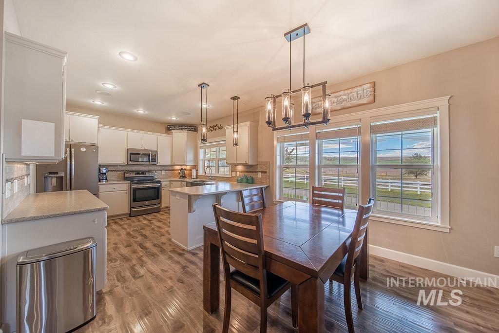 19809 Tammany Creek Road Lewiston, ID 83501 - Photo 8 of 50 Dining room featuring dark wood finished floors and recessed lighting