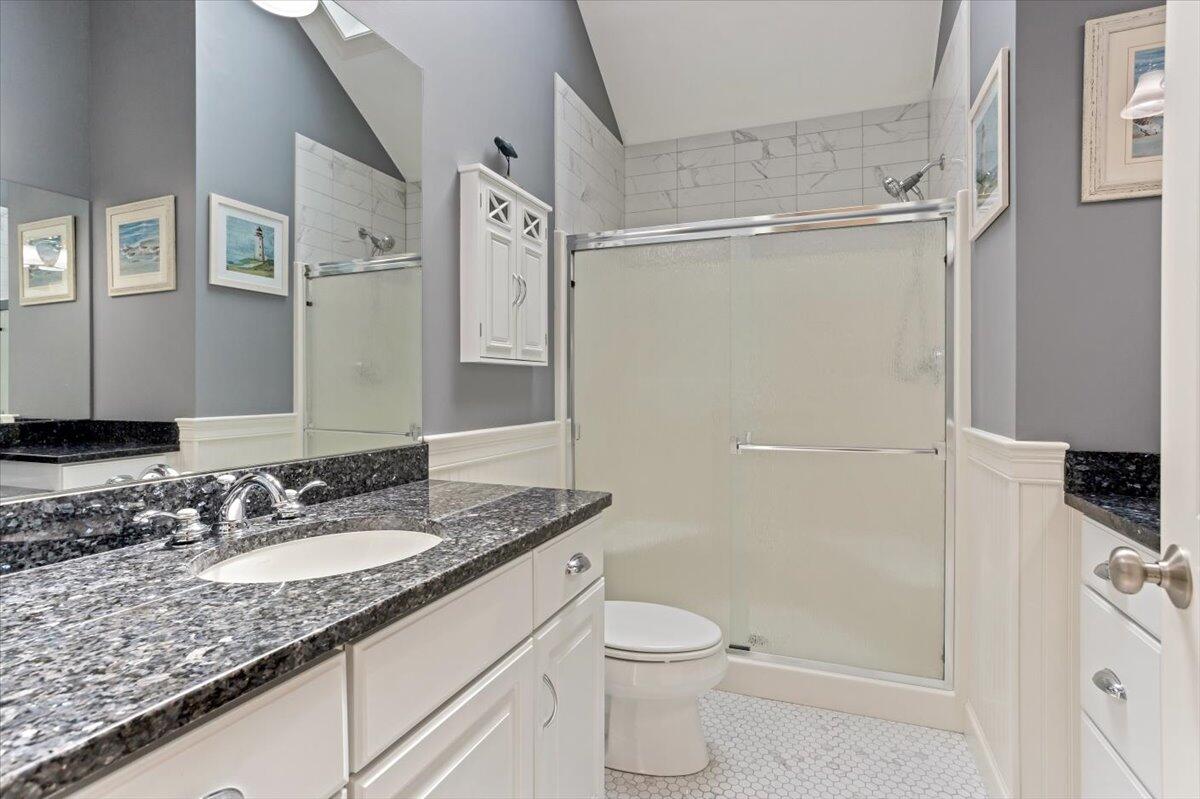 311 Pheasant Hill Circle Cotuit, MA 02635 - Photo 22 of 48 a bathroom with a granite countertop sink toilet and shower