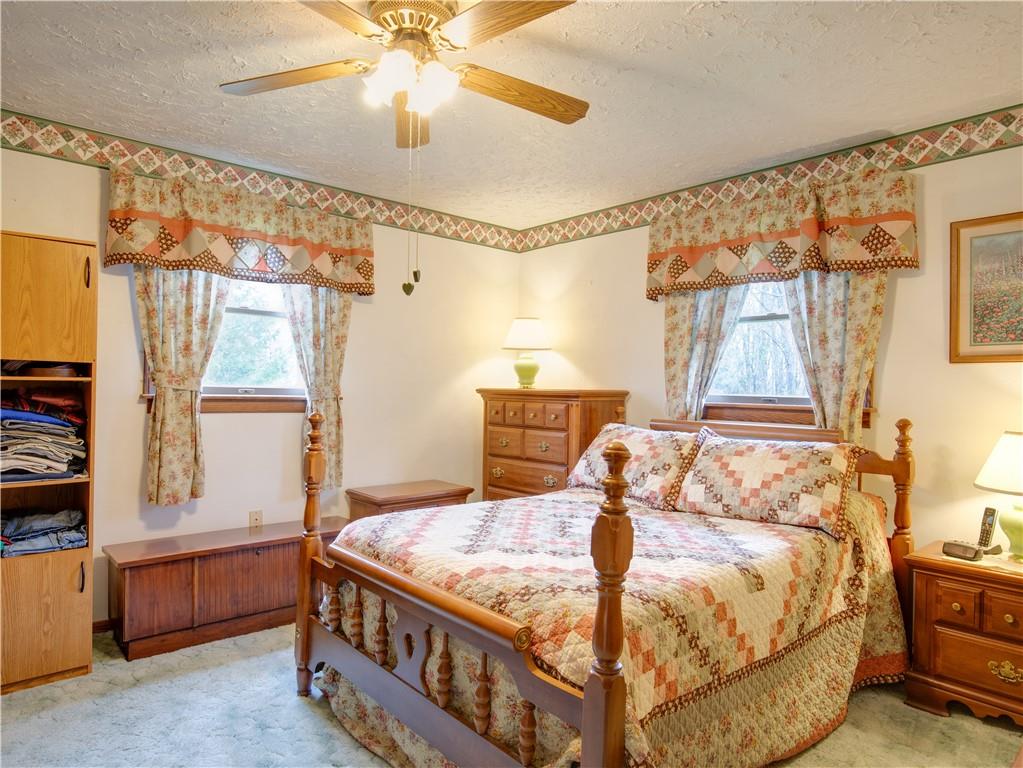 247 Medical Center Road Chicora, PA 16025 - Photo 11 of 24 a bedroom with a bed and a window