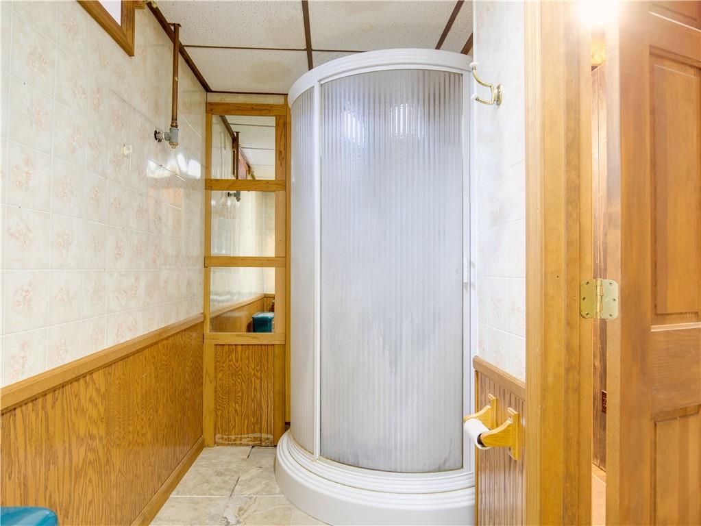 247 Medical Center Road Chicora, PA 16025 - Photo 18 of 24 a bathroom with a glass door shower and a sink