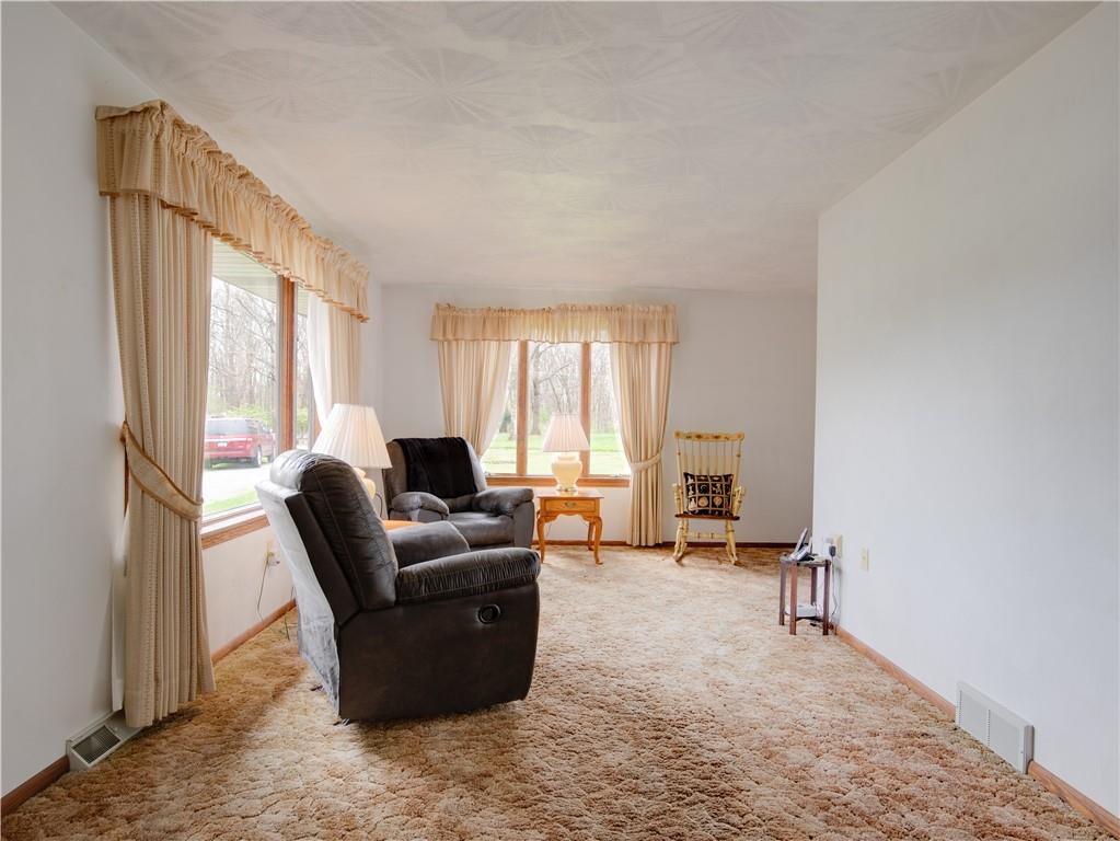 247 Medical Center Road Chicora, PA 16025 - Photo 3 of 24 a living room with furniture and large windows