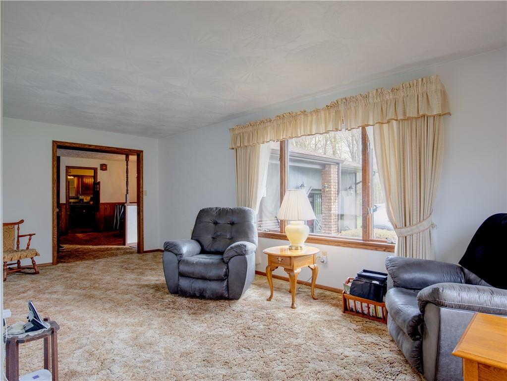 247 Medical Center Road Chicora, PA 16025 - Photo 4 of 24 a living room with furniture and a large window