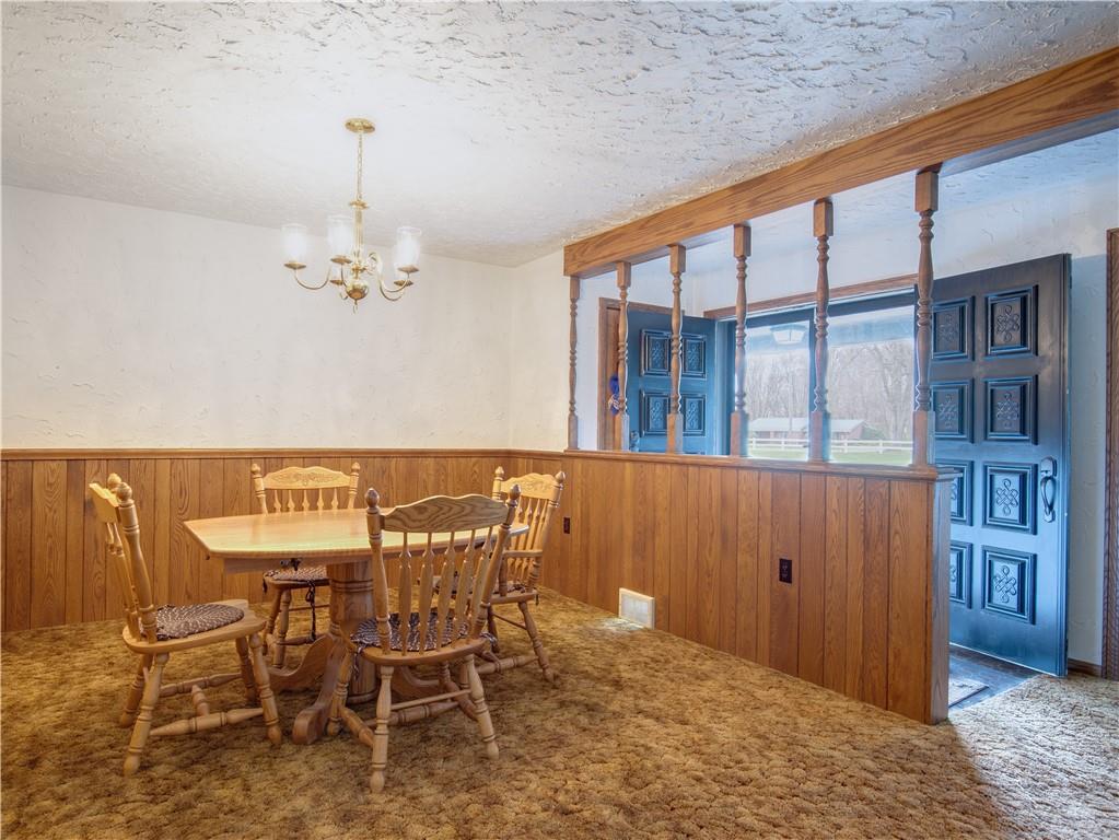 247 Medical Center Road Chicora, PA 16025 - Photo 5 of 24 a view of a dining room with furniture and chandelier
