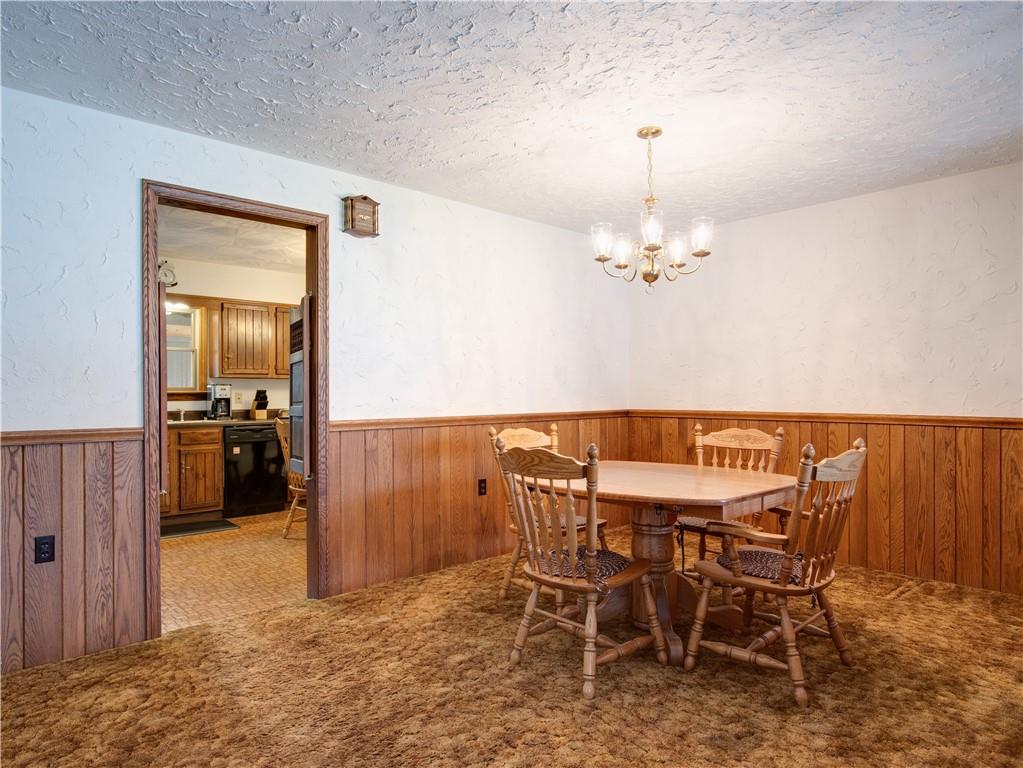 247 Medical Center Road Chicora, PA 16025 - Photo 6 of 24 a view of a dining room with furniture and chandelier