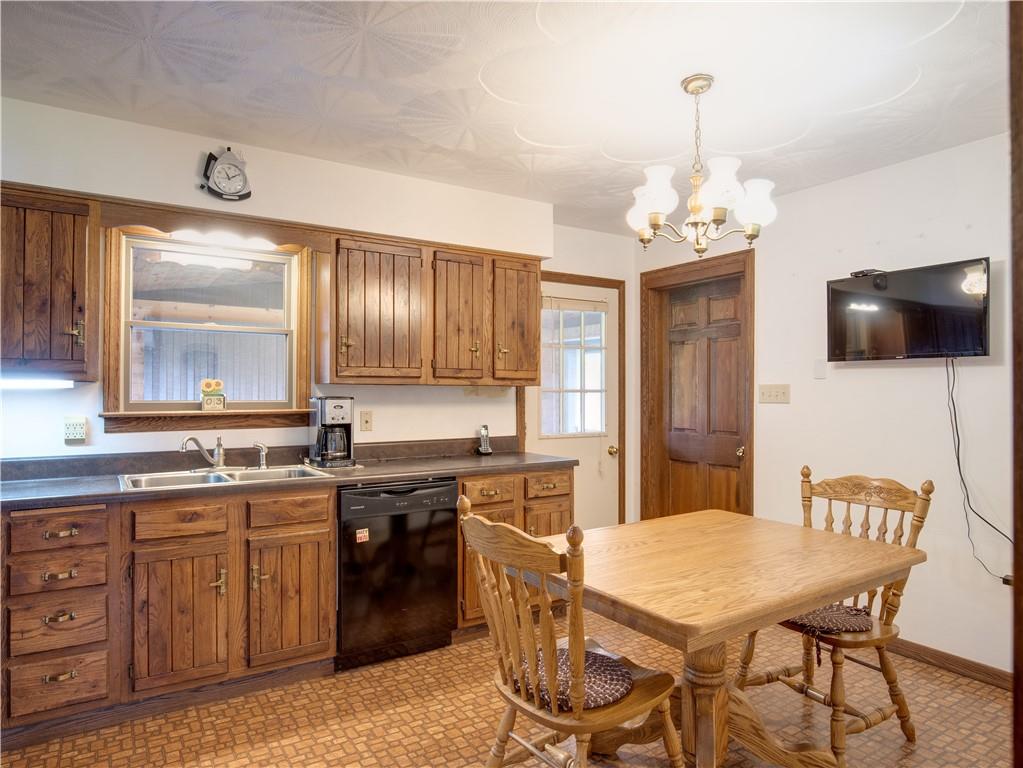 247 Medical Center Road Chicora, PA 16025 - Photo 7 of 24 a kitchen with a table chairs sink and cabinets