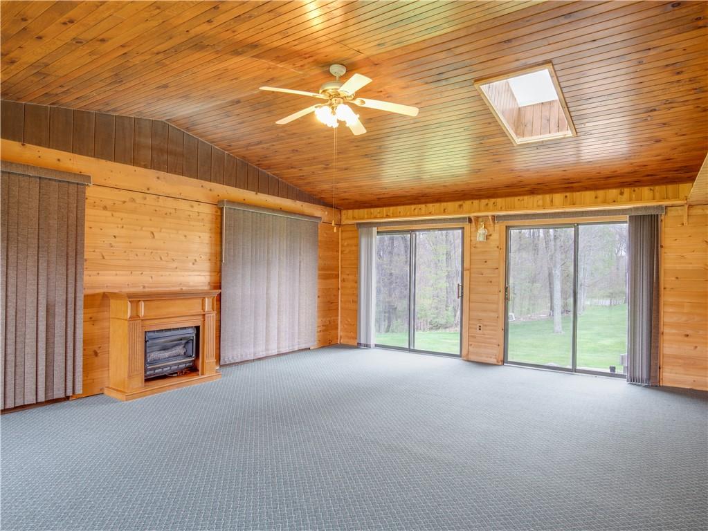 247 Medical Center Road Chicora, PA 16025 - Photo 9 of 24 a view of an empty room with a fireplace and a window
