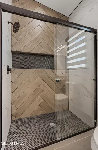 a bathroom with a sink and a shower