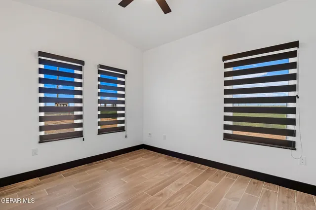 a view of a room with stairs and wooden floor