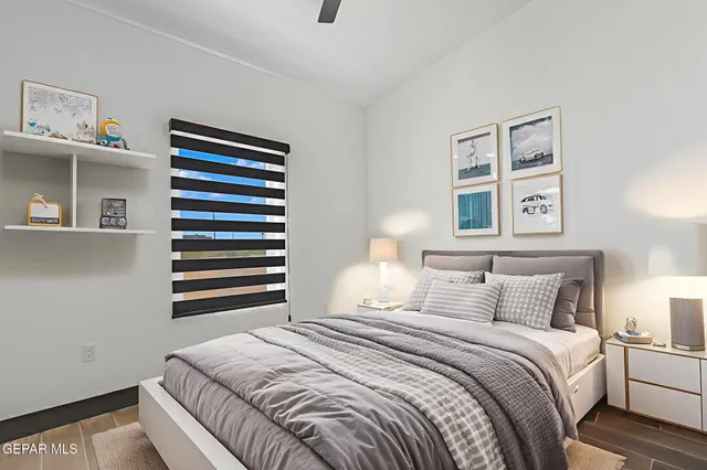 a bedroom with a bed and a window