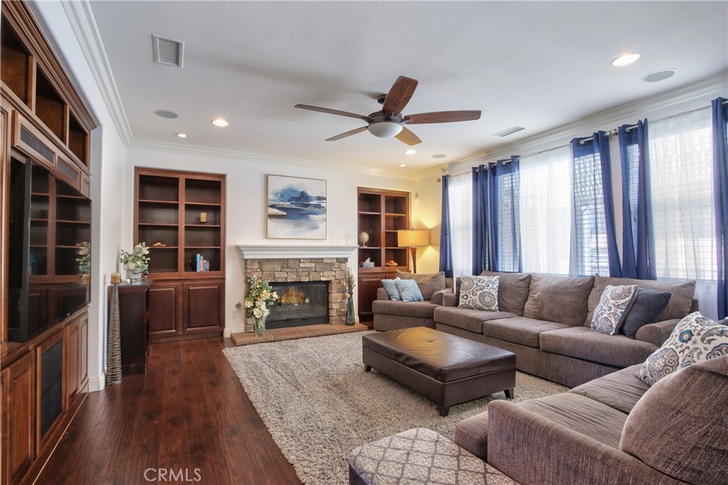 28483 Nautical Point Circle Menifee, CA 92585 - Photo 8 of 44 a living room with furniture fireplace and flat screen tv