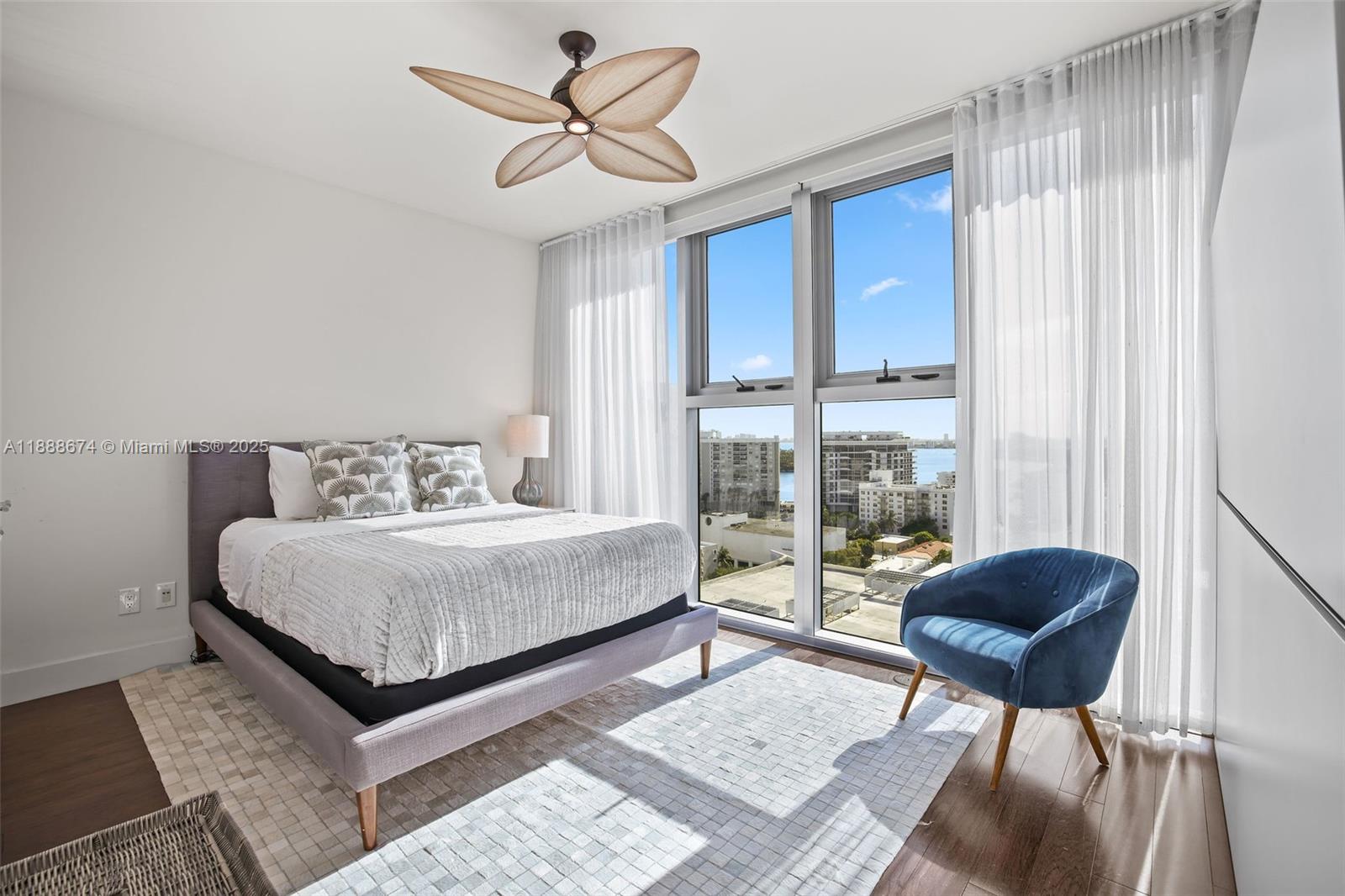 6899 Collins Avenue, Unit 1610 Miami Beach, FL 33141 - Photo 12 of 35 a bedroom with a bed and a chair