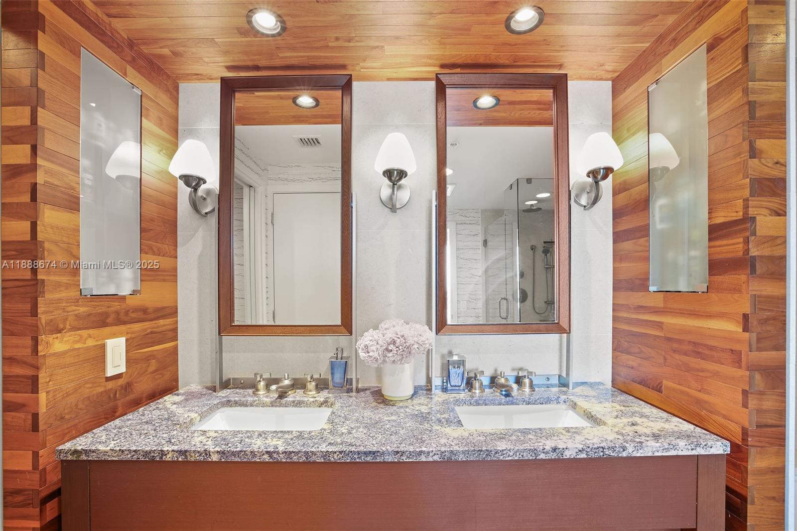 6899 Collins Avenue, Unit 1610 Miami Beach, FL 33141 - Photo 15 of 35 a bathroom with a granite countertop sink and a mirror