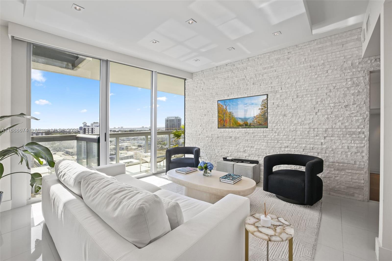 6899 Collins Avenue, Unit 1610 Miami Beach, FL 33141 - Photo 5 of 35 a bedroom with a bed a balcony a bed and a large window