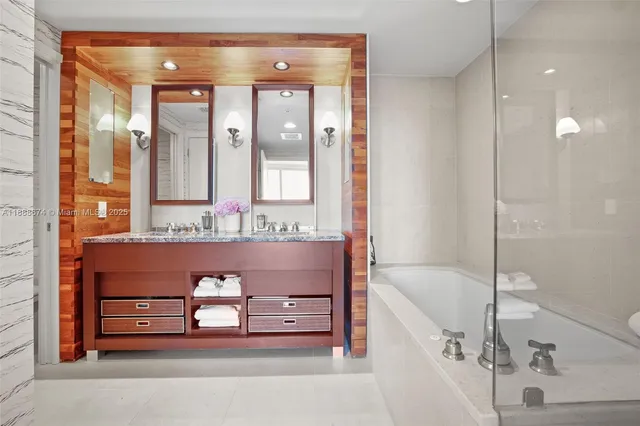 a bathroom with a bathtub and a shower