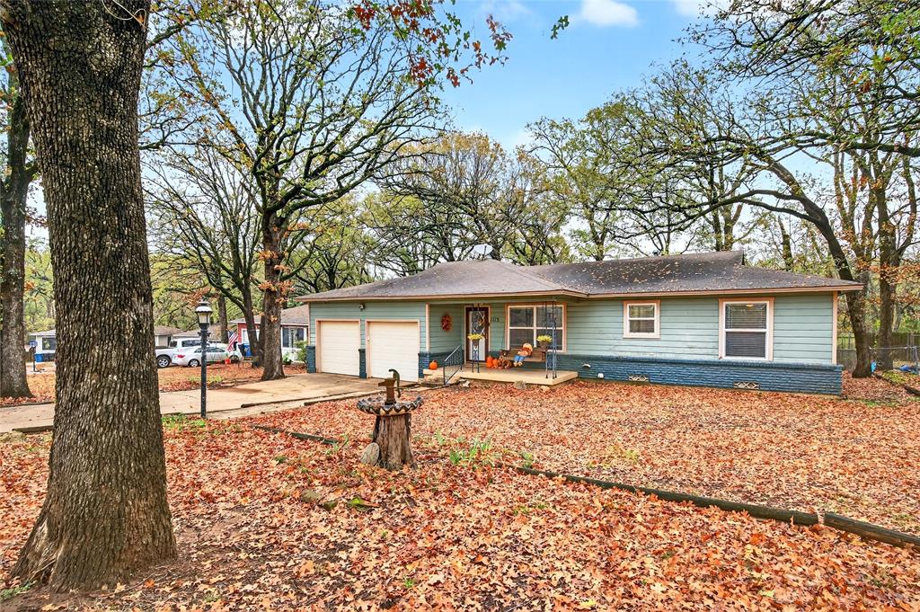 1115 Oak Ridge Drive Denison, TX 75020 - Photo 1 of 32 a house with a outdoor space