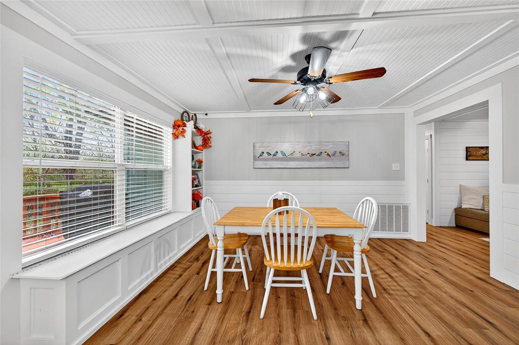 1115 Oak Ridge Drive Denison, TX 75020 - Photo 11 of 32 a view of a dining room with furniture window and wooden floor