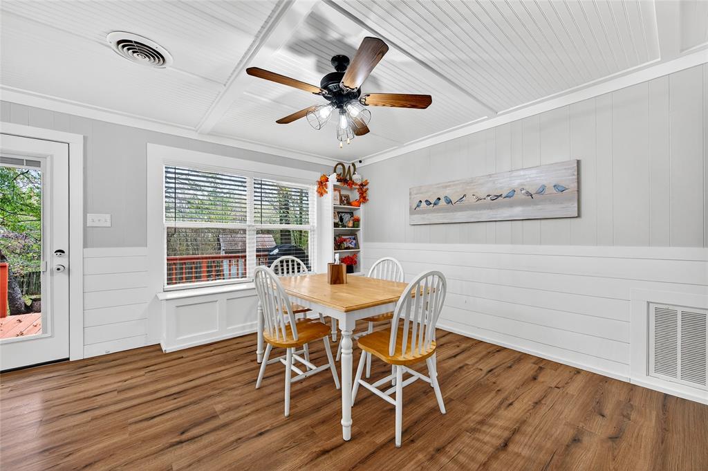 1115 Oak Ridge Drive Denison, TX 75020 - Photo 12 of 32 a view of a dining room with furniture window and wooden floor