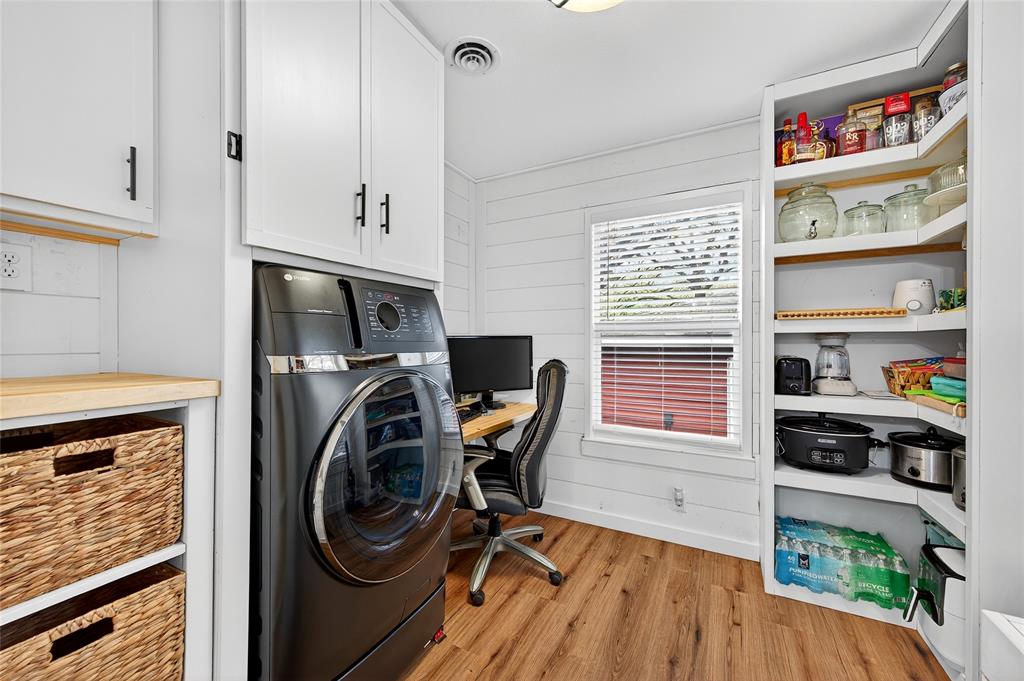 1115 Oak Ridge Drive Denison, TX 75020 - Photo 17 of 32 a view of a kitchen with fridge and rack