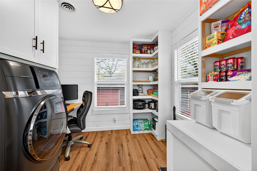 1115 Oak Ridge Drive Denison, TX 75020 - Photo 18 of 32 a view of a kitchen with workspace and a window