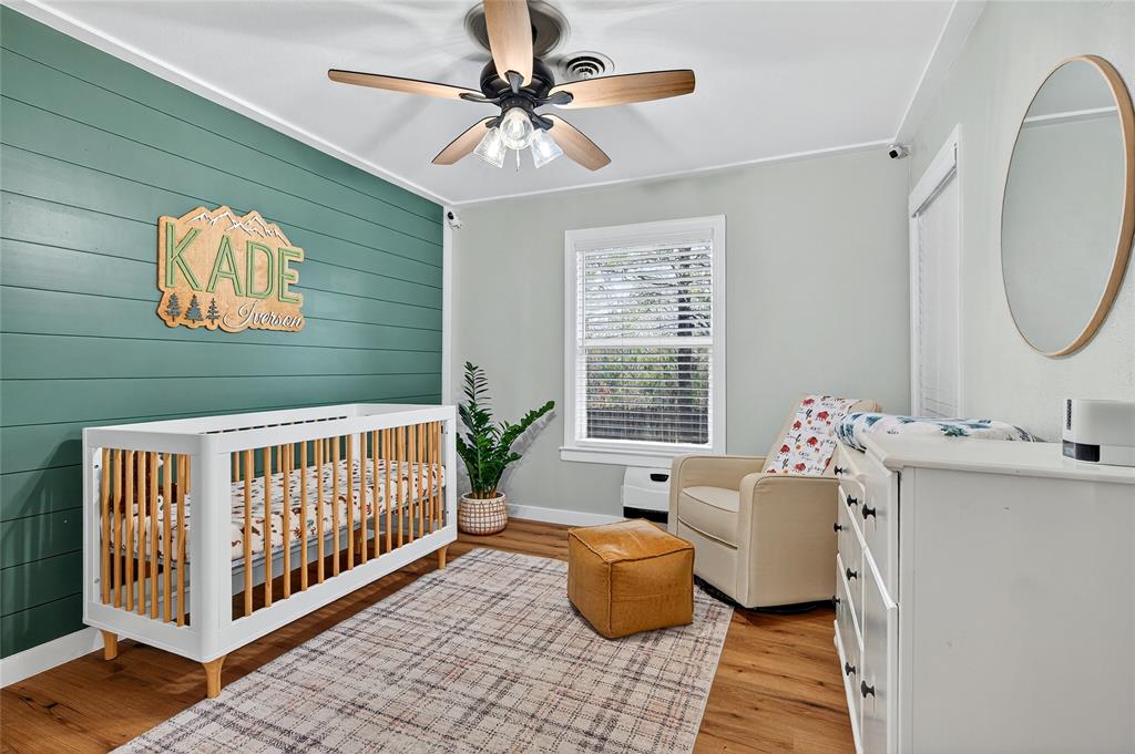 1115 Oak Ridge Drive Denison, TX 75020 - Photo 25 of 32 a view of a dining room with furniture window and wooden floor
