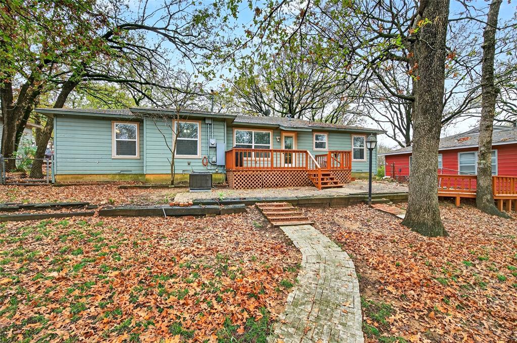1115 Oak Ridge Drive Denison, TX 75020 - Photo 28 of 32 front view of a house with a yard