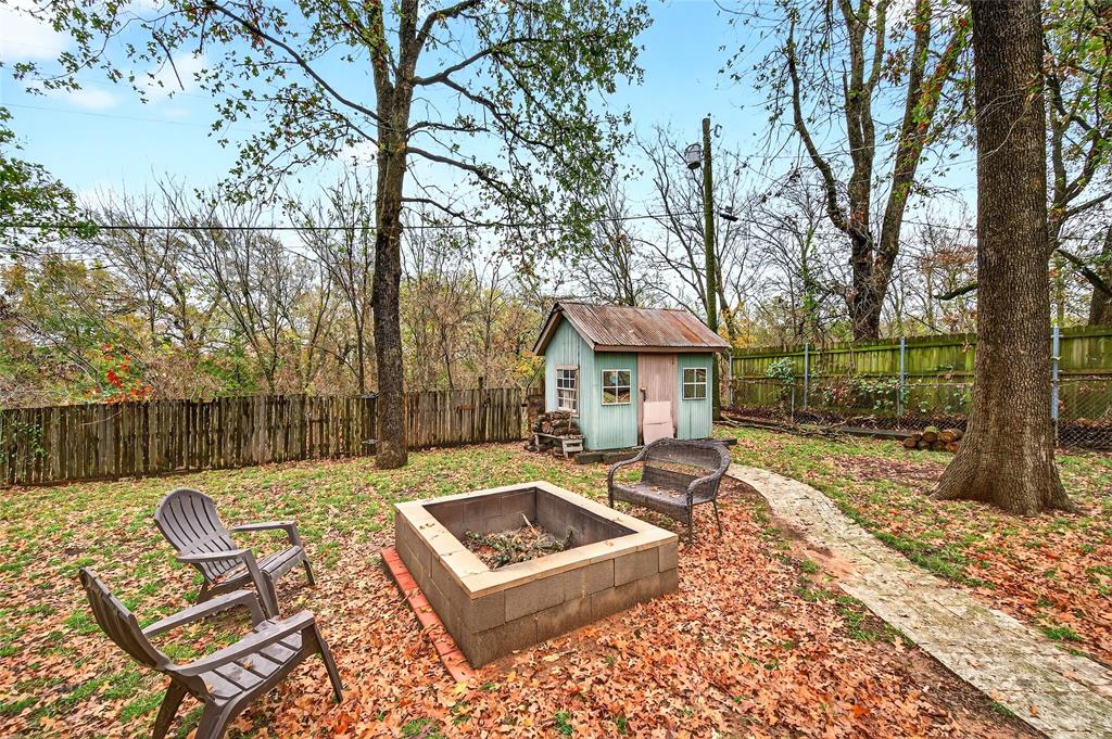 1115 Oak Ridge Drive Denison, TX 75020 - Photo 31 of 32 a view of a house with backyard and sitting area