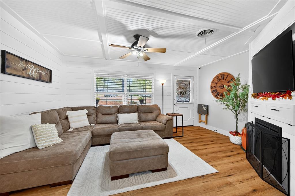 1115 Oak Ridge Drive Denison, TX 75020 - Photo 7 of 32 a living room with furniture fireplace and flat screen tv