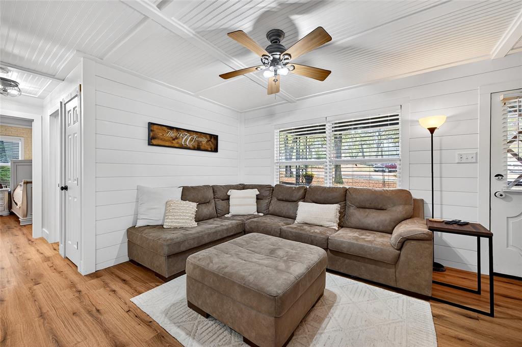 1115 Oak Ridge Drive Denison, TX 75020 - Photo 8 of 32 a living room with furniture and a large window