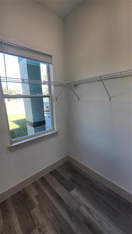 23469 Roscoe Avenue Punta Gorda, FL 33980 - Photo 15 of 26 a view of a room that has a window and wooden floor