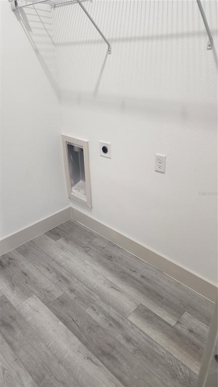 23469 Roscoe Avenue Punta Gorda, FL 33980 - Photo 24 of 26 a view of a livingroom with wooden floor and a window