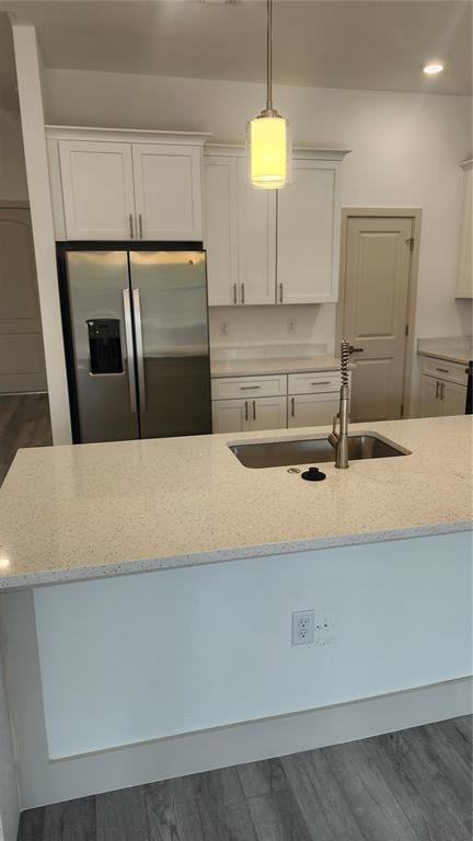 23469 Roscoe Avenue Punta Gorda, FL 33980 - Photo 6 of 26 a kitchen with a sink and a refrigerator