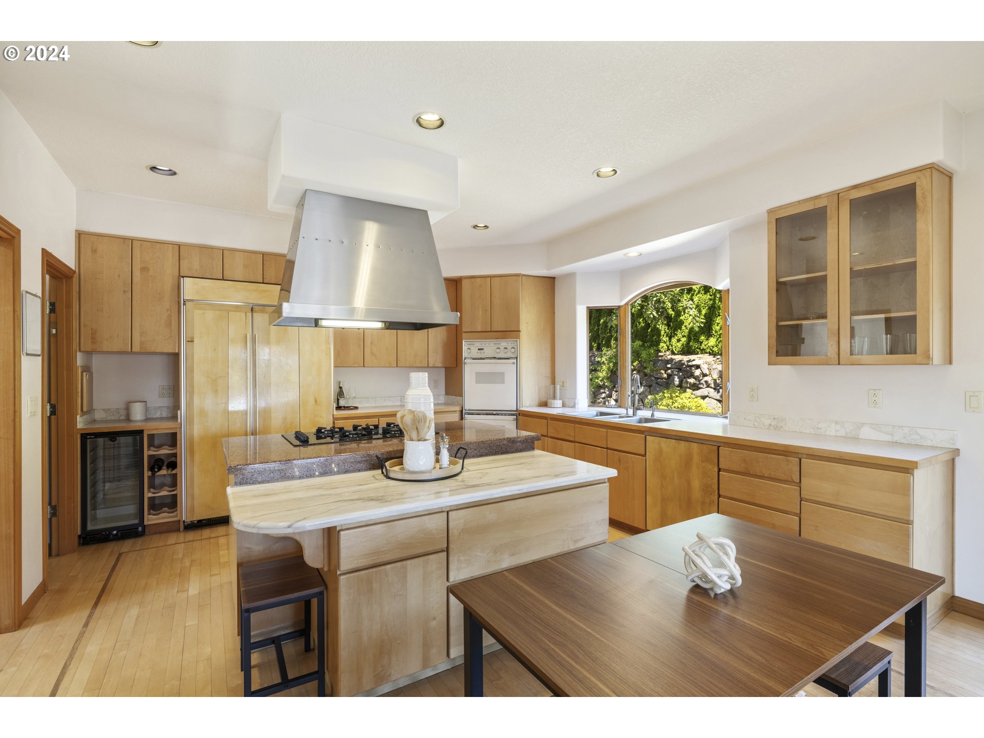 11400 Northwest Plainview Road Portland, OR 97231 - Photo 13 of 48 a kitchen with kitchen island granite countertop a sink cabinets and stainless steel appliances