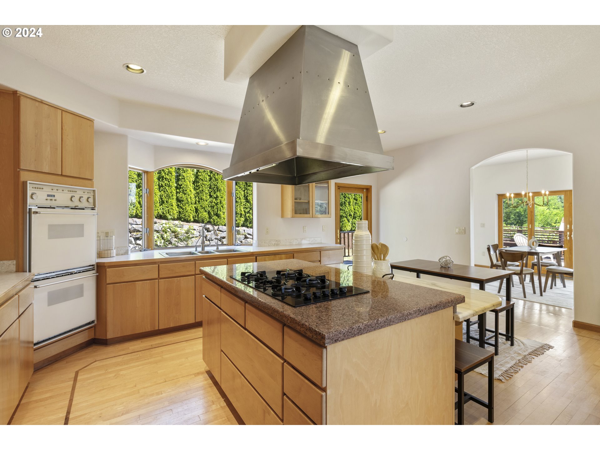 11400 Northwest Plainview Road Portland, OR 97231 - Photo 15 of 48 a kitchen with stainless steel appliances granite countertop a stove a sink and a refrigerator