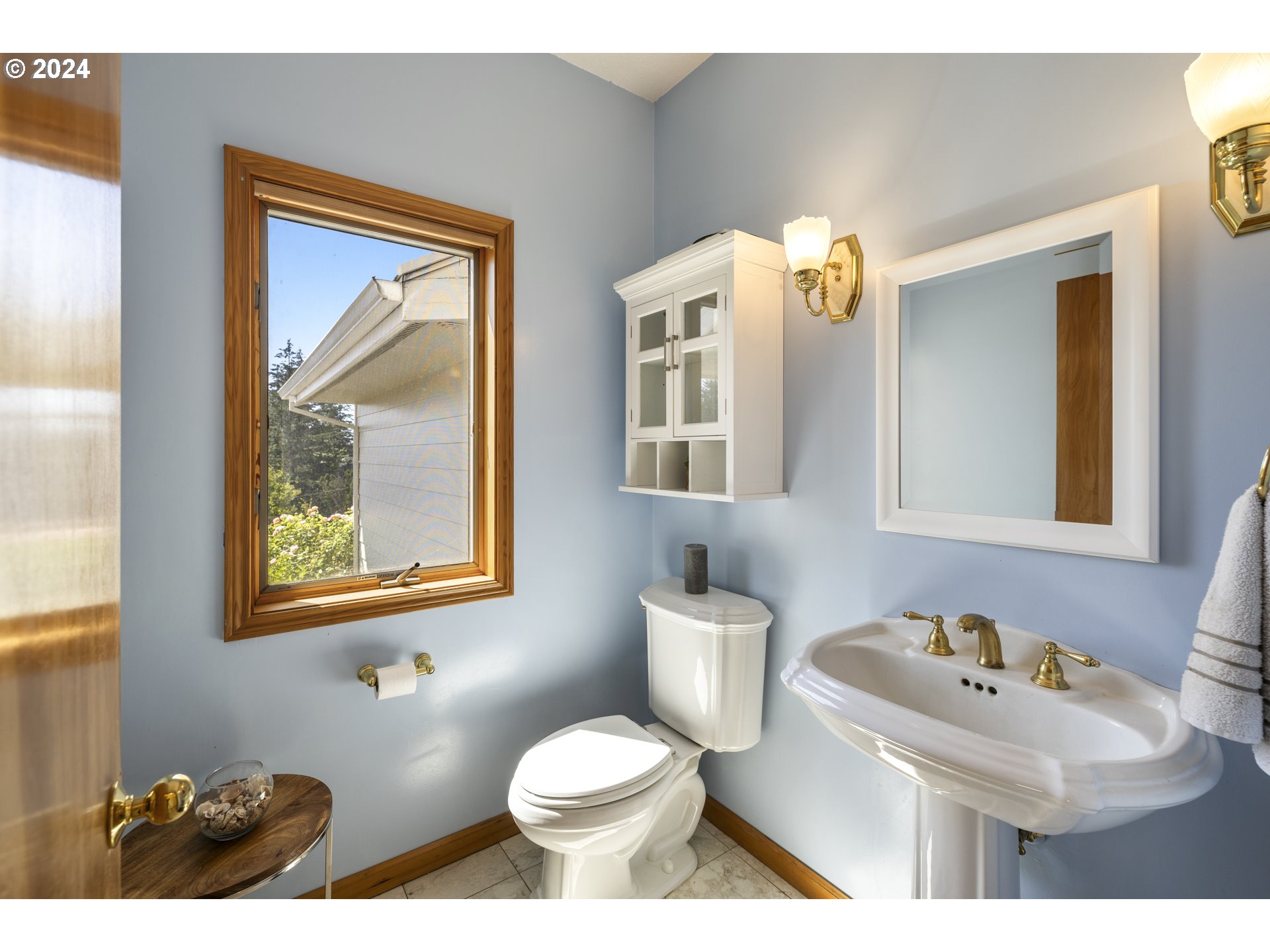 11400 Northwest Plainview Road Portland, OR 97231 - Photo 18 of 48 a bathroom with a toilet sink and mirror