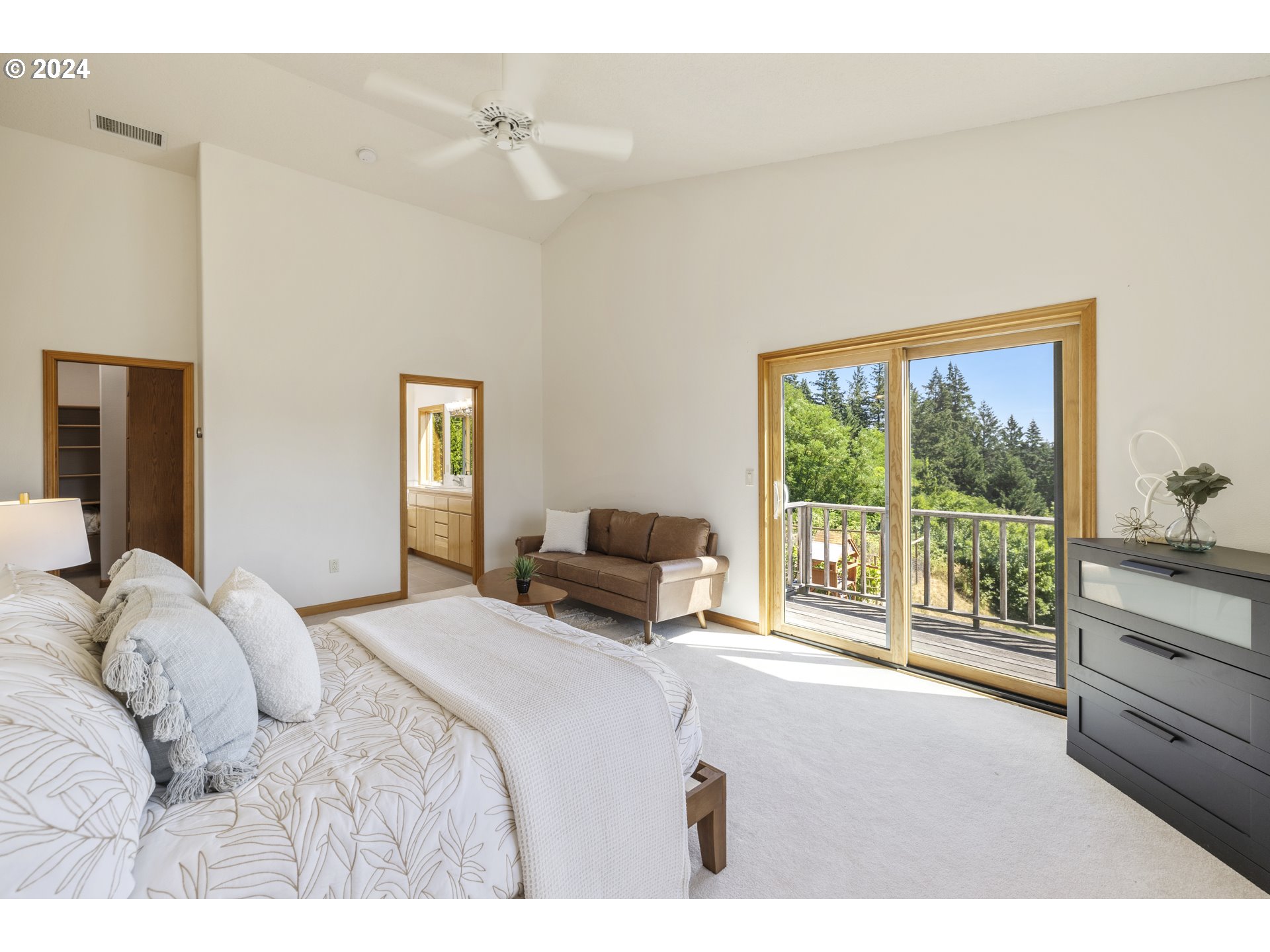 11400 Northwest Plainview Road Portland, OR 97231 - Photo 21 of 48 a bedroom with a bed and large windows