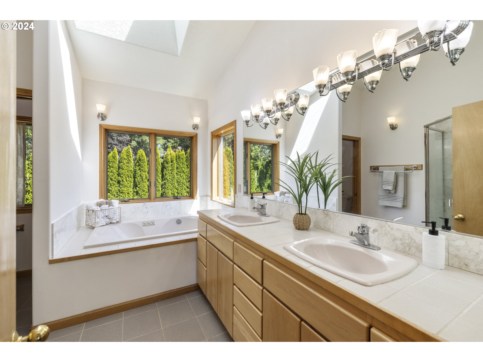 11400 Northwest Plainview Road Portland, OR 97231 - Photo 23 of 48 a bathroom with a sink vanity granite tub and a mirror