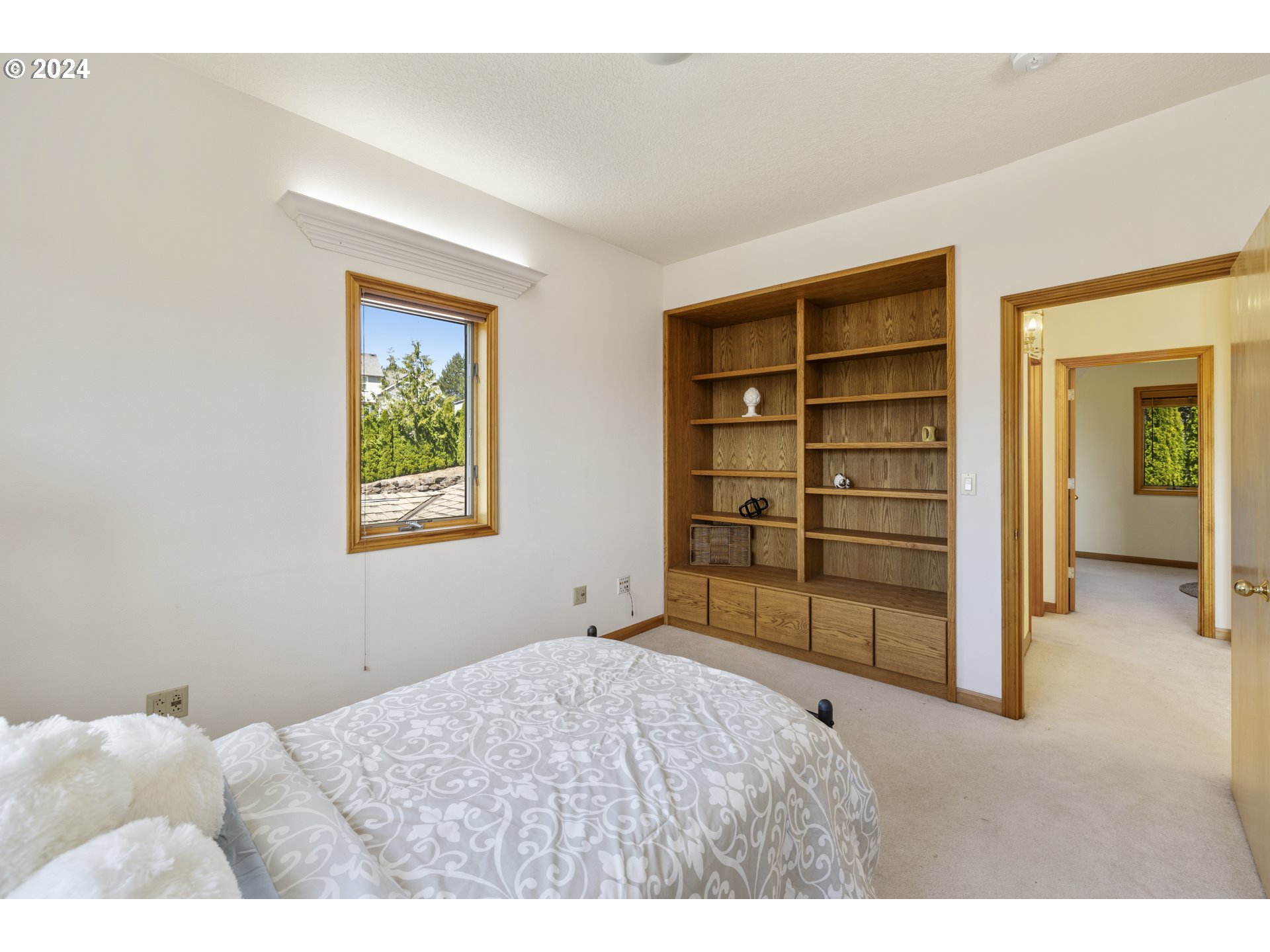 11400 Northwest Plainview Road Portland, OR 97231 - Photo 26 of 48 a bedroom with a bed and a cabinets