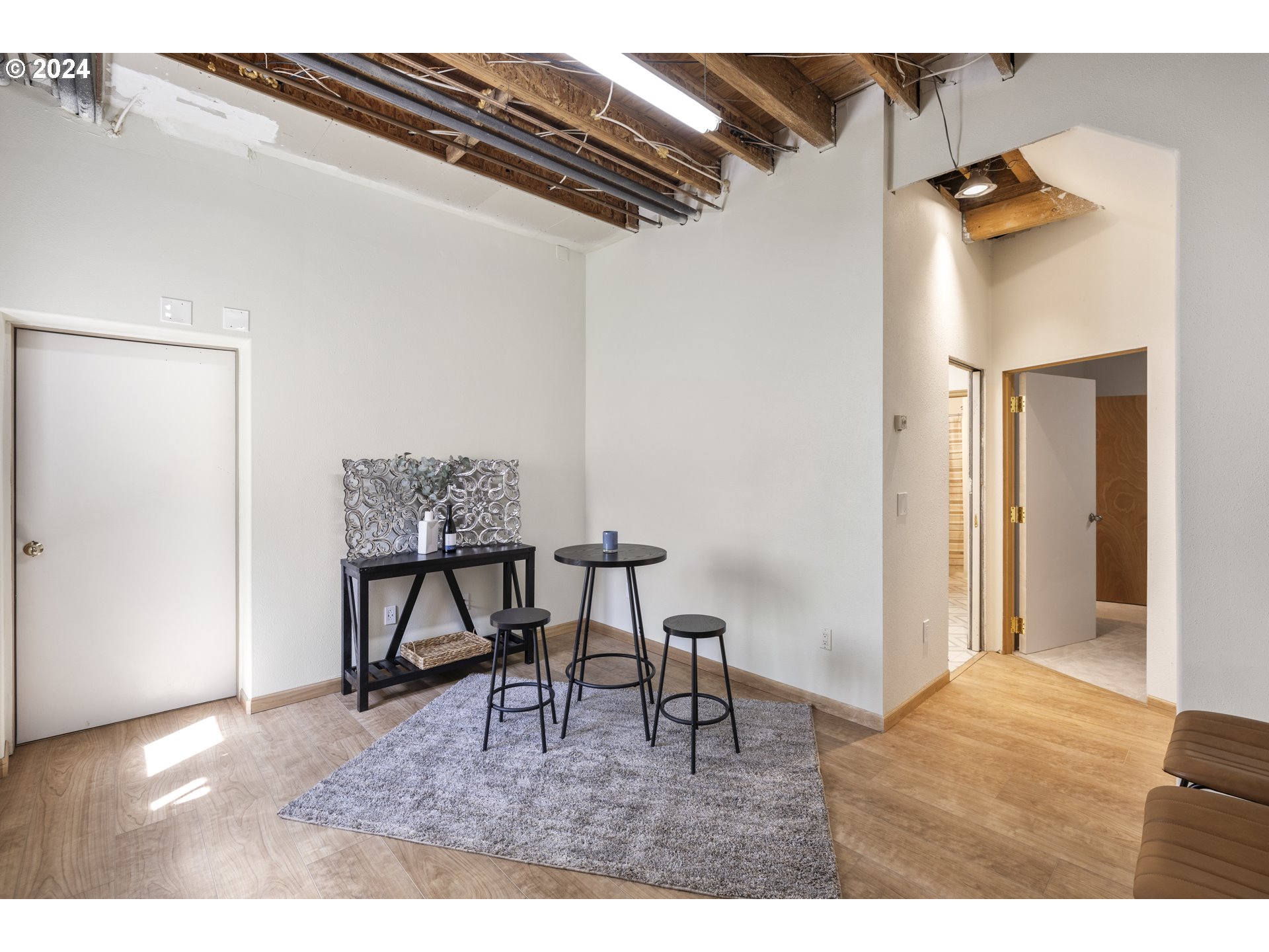 11400 Northwest Plainview Road Portland, OR 97231 - Photo 30 of 48 a bedroom with a bed and a table in it